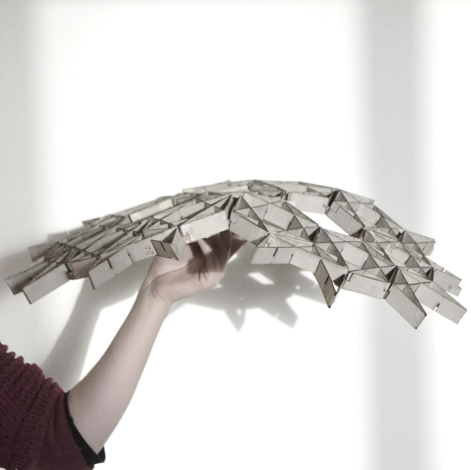 interlock: the lattice flexing into a shell