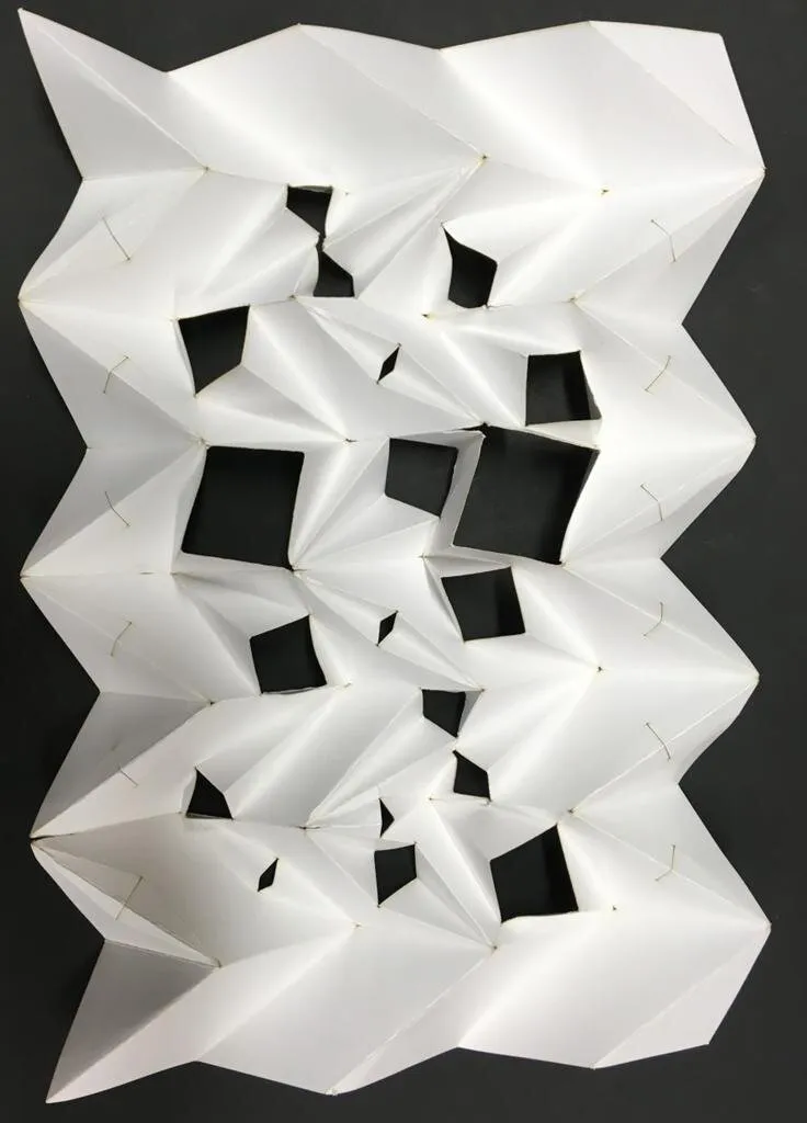 miura-ori tessellation: cuts with symmetrical folds: miura-ori tessellation with irregular cut pattern