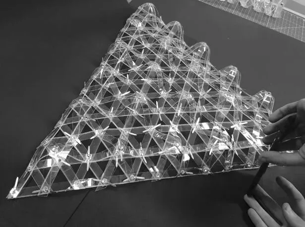 deployability as a temporary structure: copolyester prototype of the dimpled grid