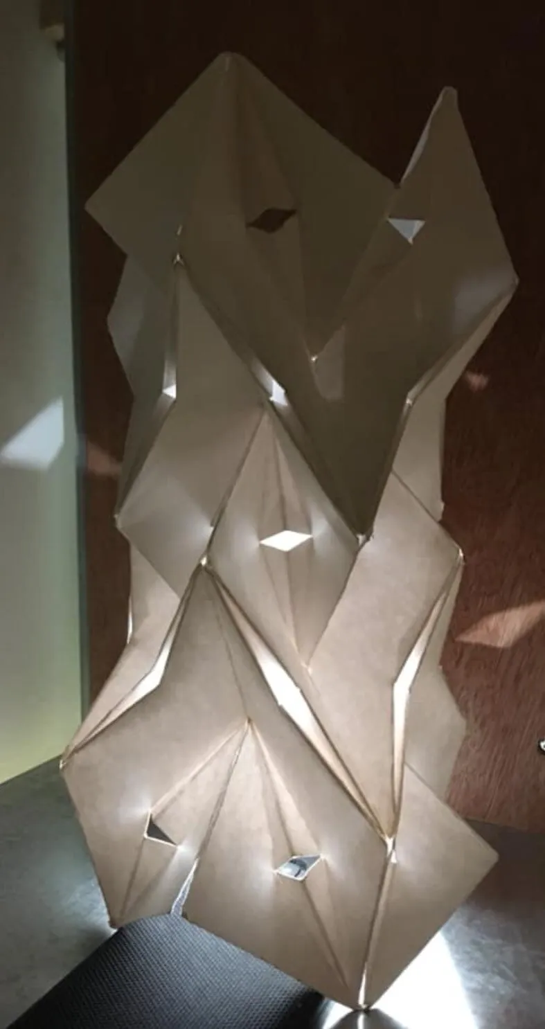 miura-ori tessellation: cuts with asymmetrical folds: backlit folded surface