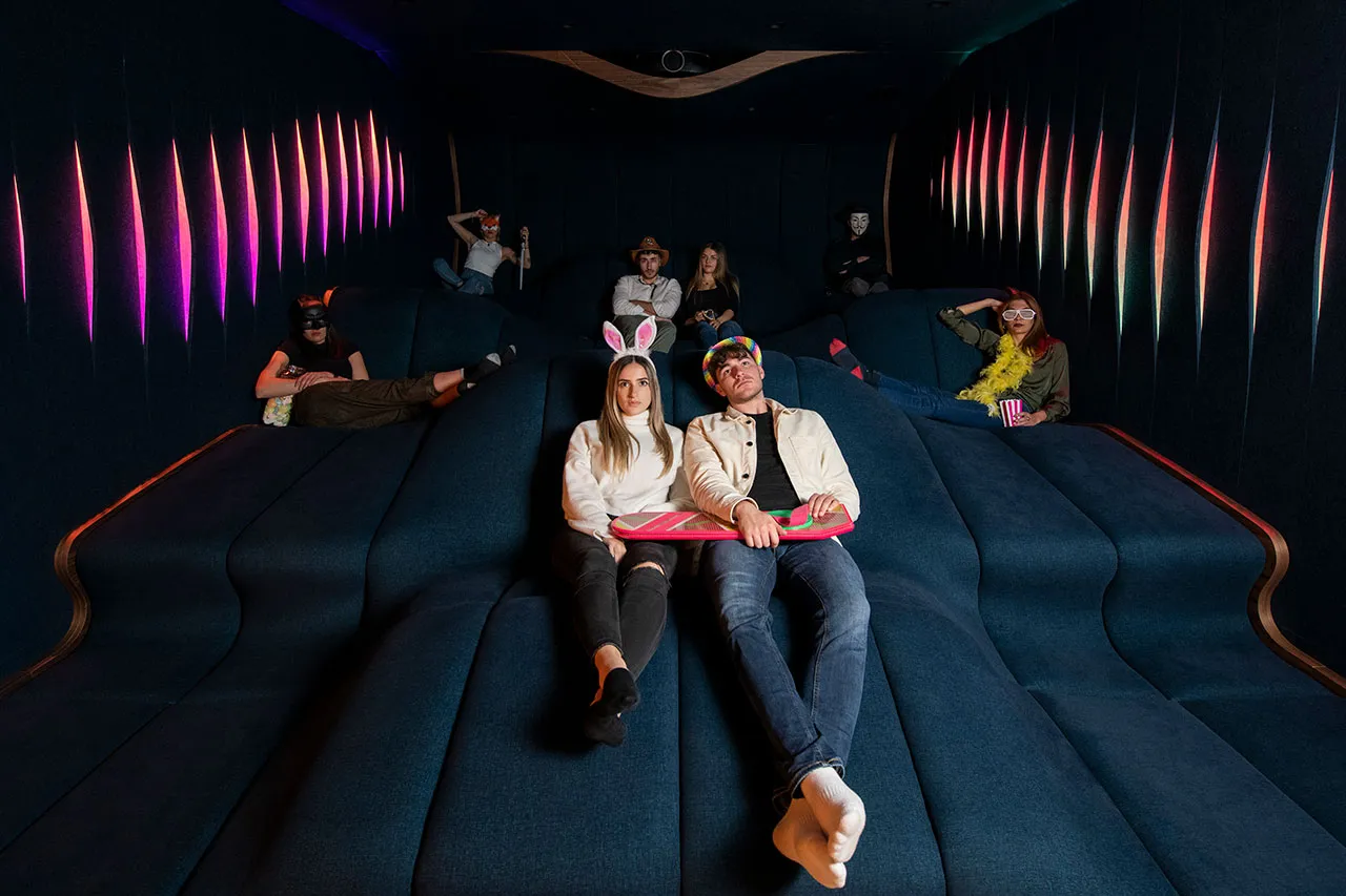 Cinema Visiona in operation, two people lying back on the seating terrain