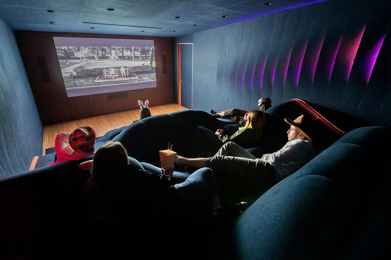 the seating terrain and acoustic fins of a basement home cinema