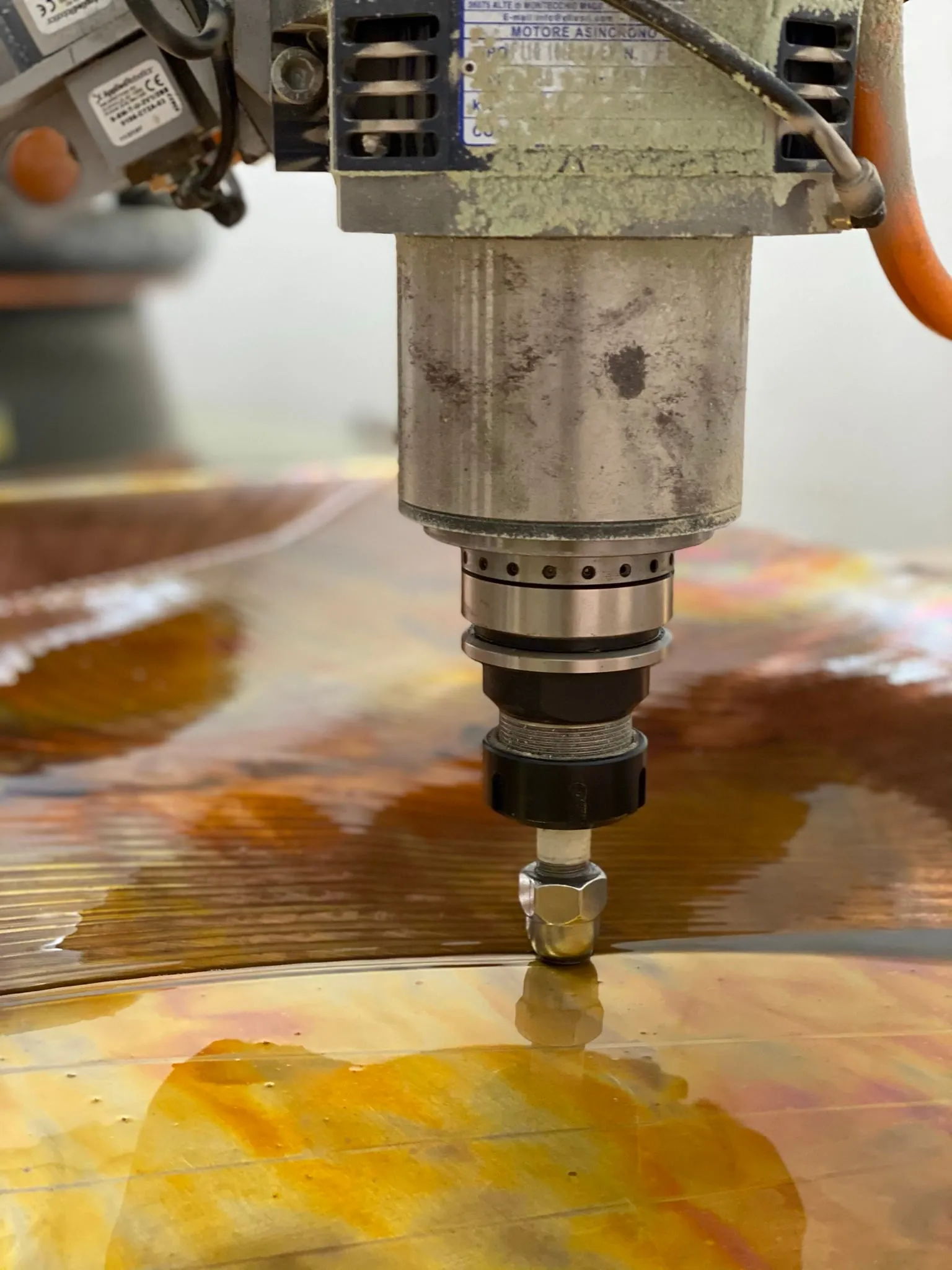 farsons old brewhouse desk, the round-tipped tool pressing into the oiled sheet