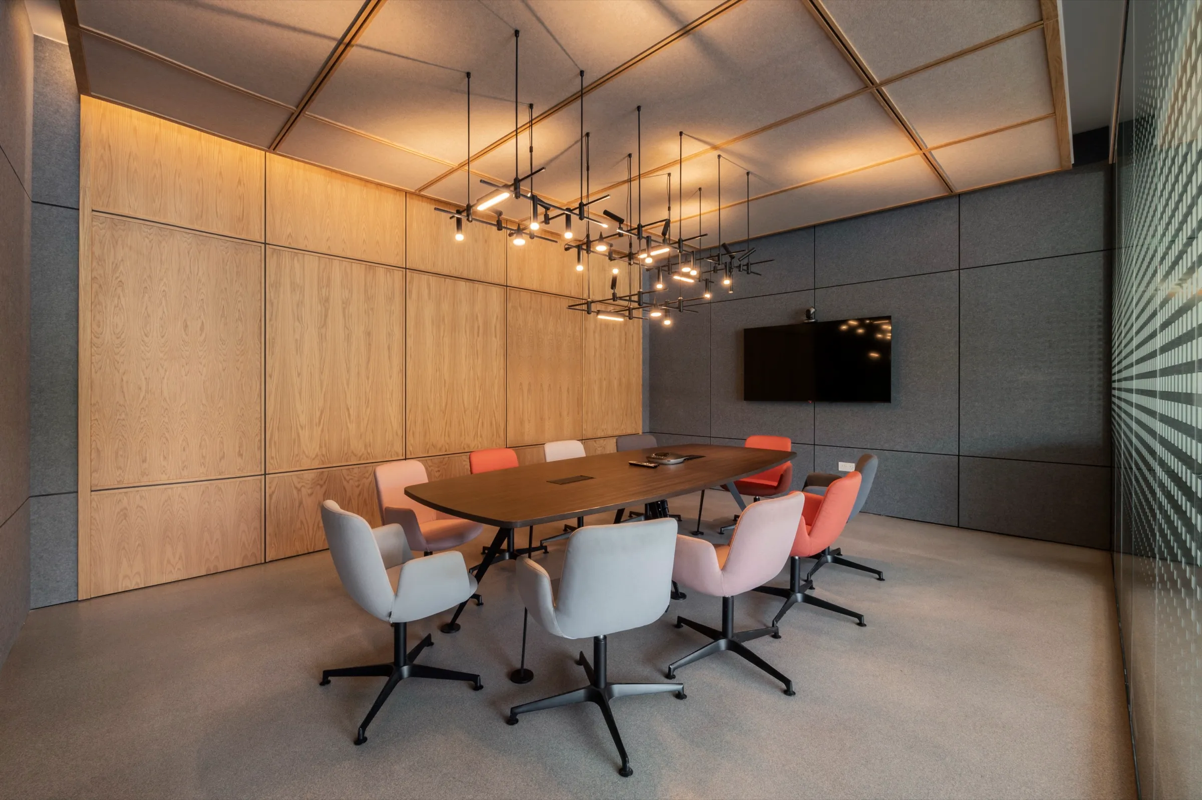 The boardroom, clad in timber panelling and recycled PET felt