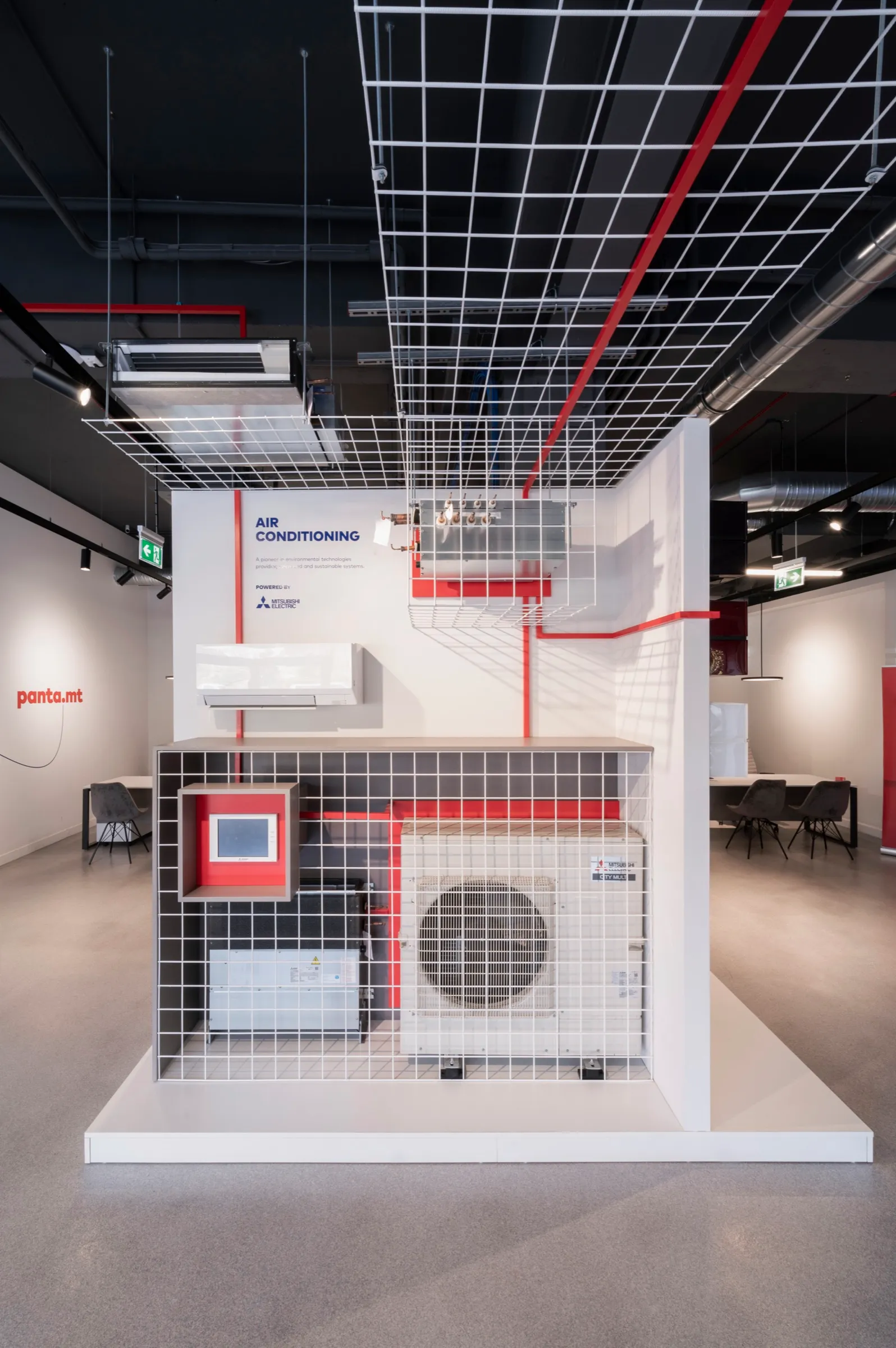 A product display wall in the Panta showroom, with the red thread linking each piece