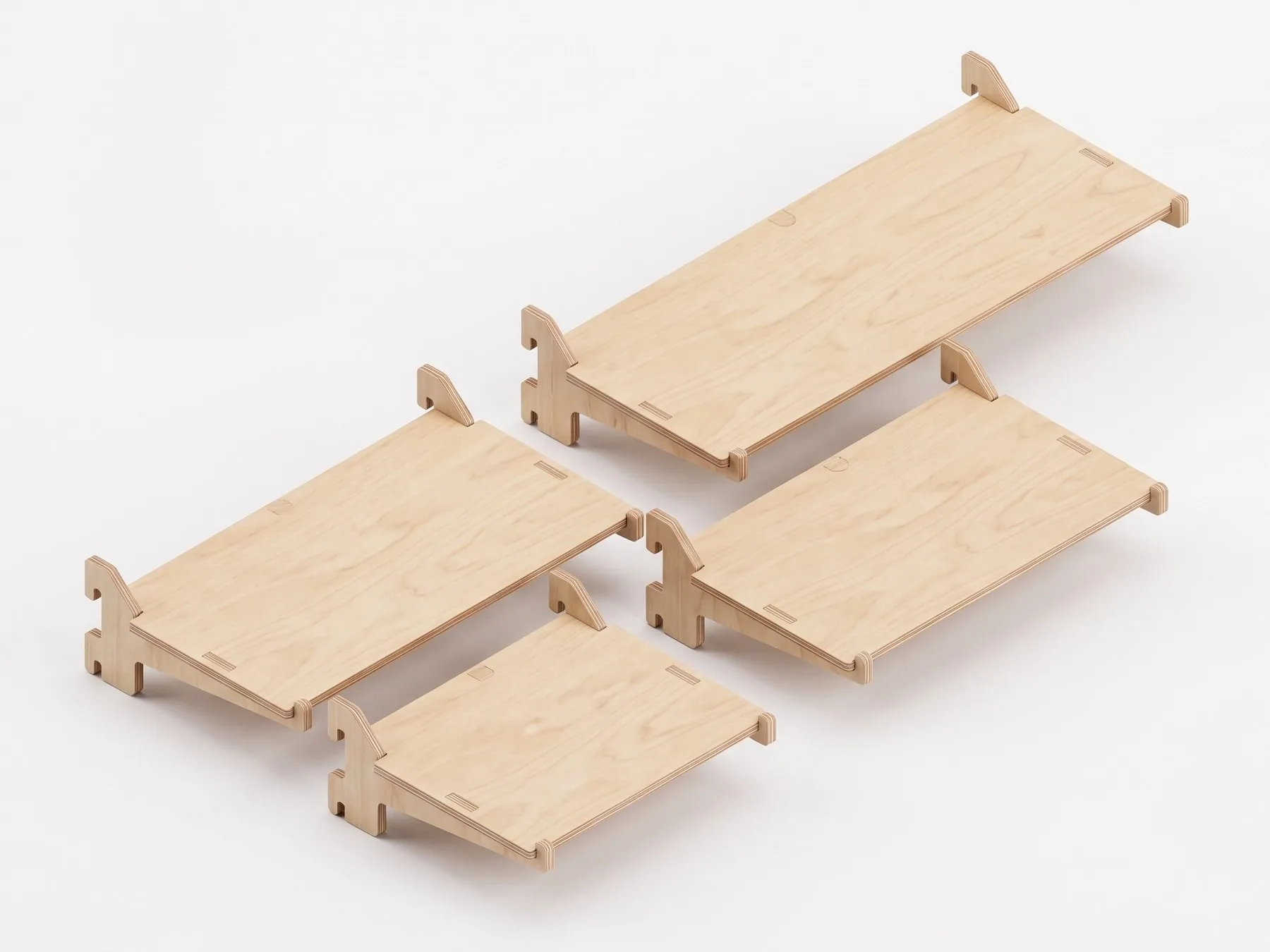 rejig desk: four plywood desks of different sizes, each on two brackets, a render