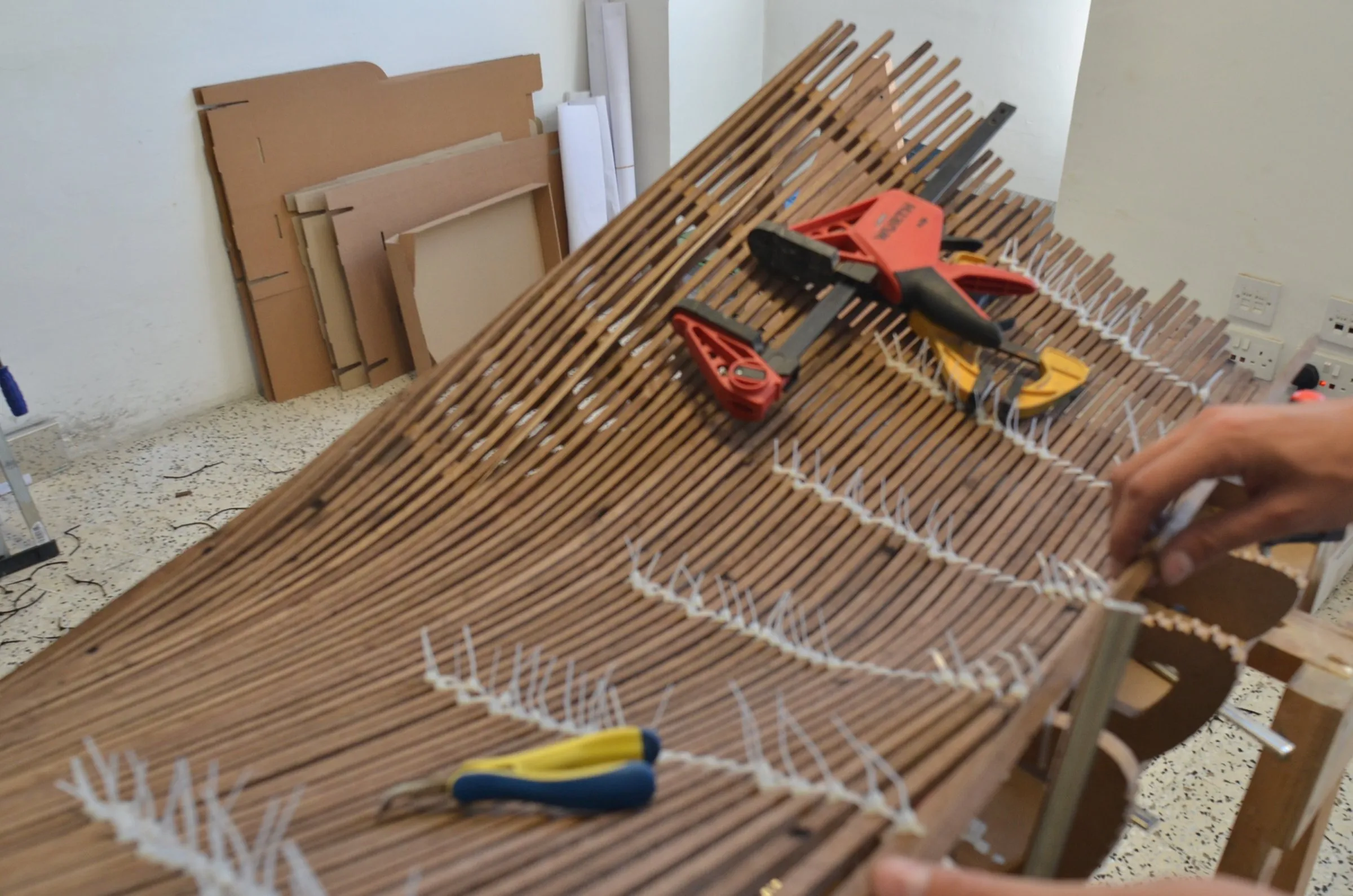 steam-bent walnut strips on the jig